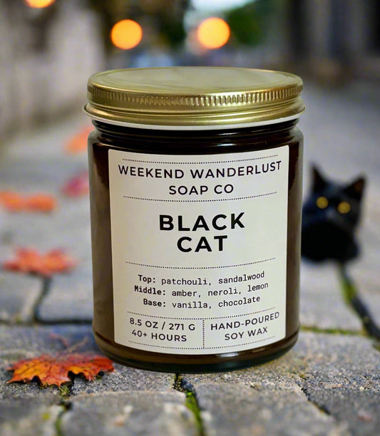 Jar of 'Black Cat' candle from Weekend Wanderlust Soap Co on a light background