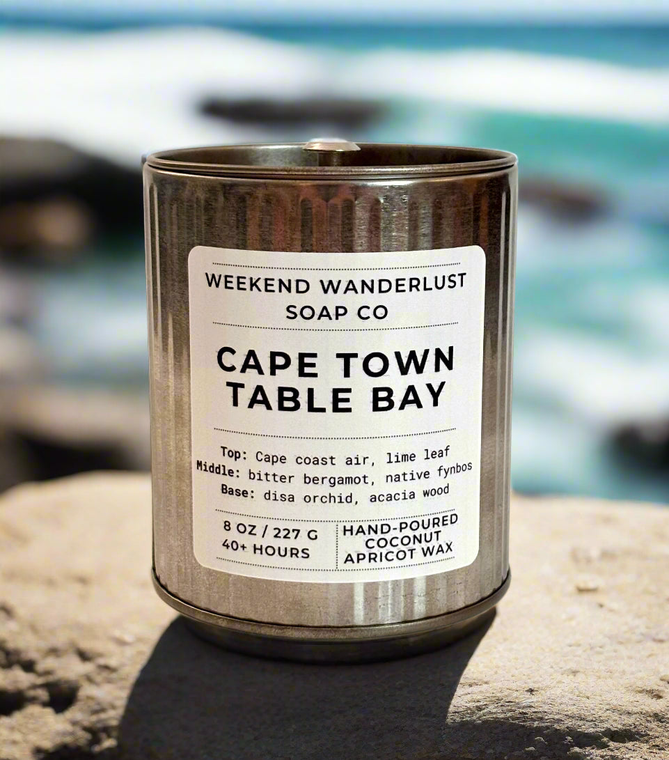 Candle in a tin with a label on a light pink background