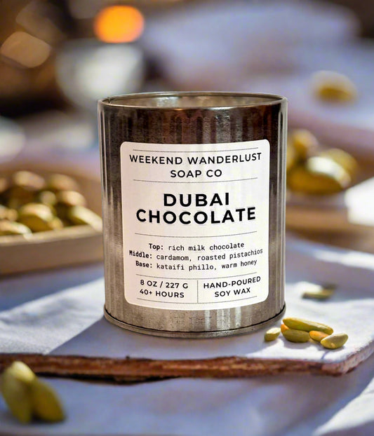 Candle with 'Weekend Wanderlust Soap Co' label on a white background