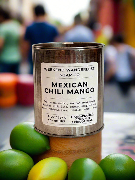 Candle in a tin with a label on a light pink background