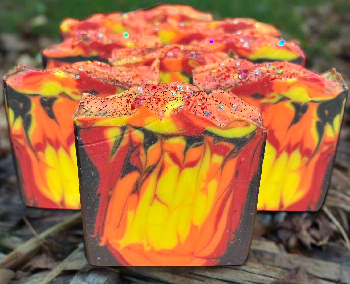 Colorful soap bars with a flame design on a natural background