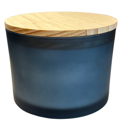 Cylindrical dark blue container with a wooden lid on a light background