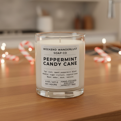 Candle labeled 'Peppermint Candy Cane' by Weekend Wanderlust Soap Co. on a kitchen counter.